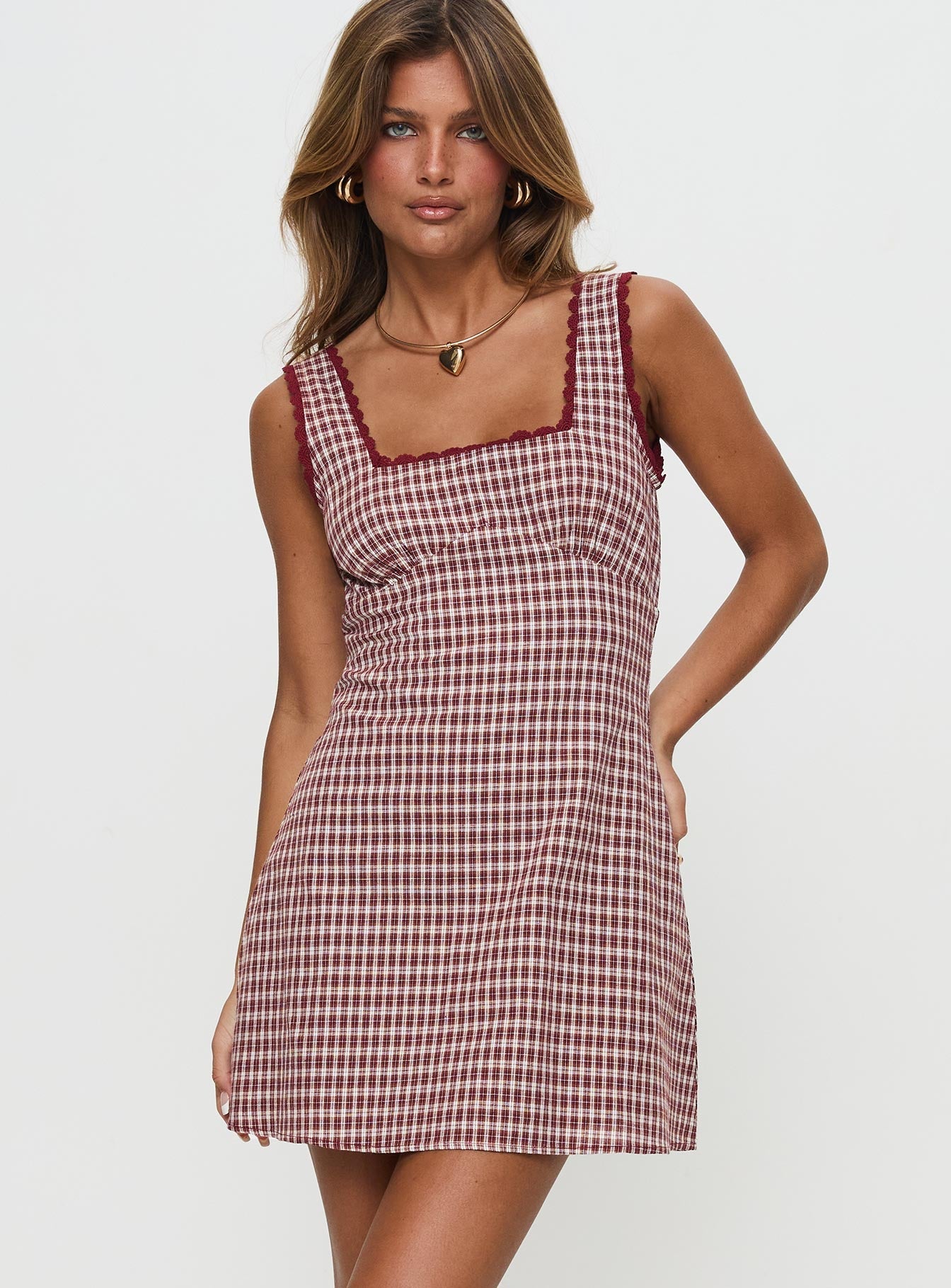 front view of model wearing Princess Polly Dasha Mini Dress Red Check Square Neck 