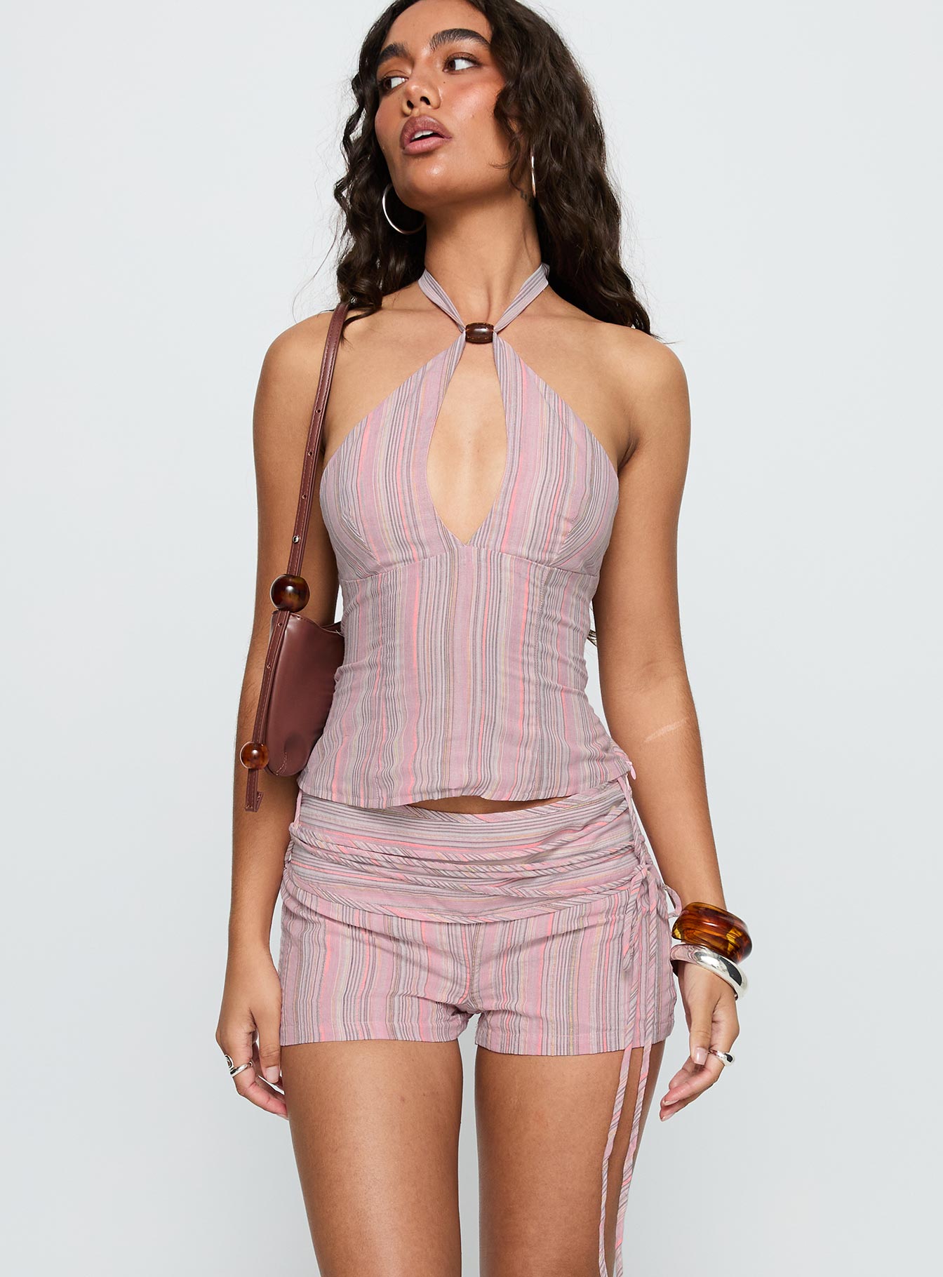 side view of model wearing Princess Polly Electric Night Shorts Pink Stripe Low Rise Shorts 