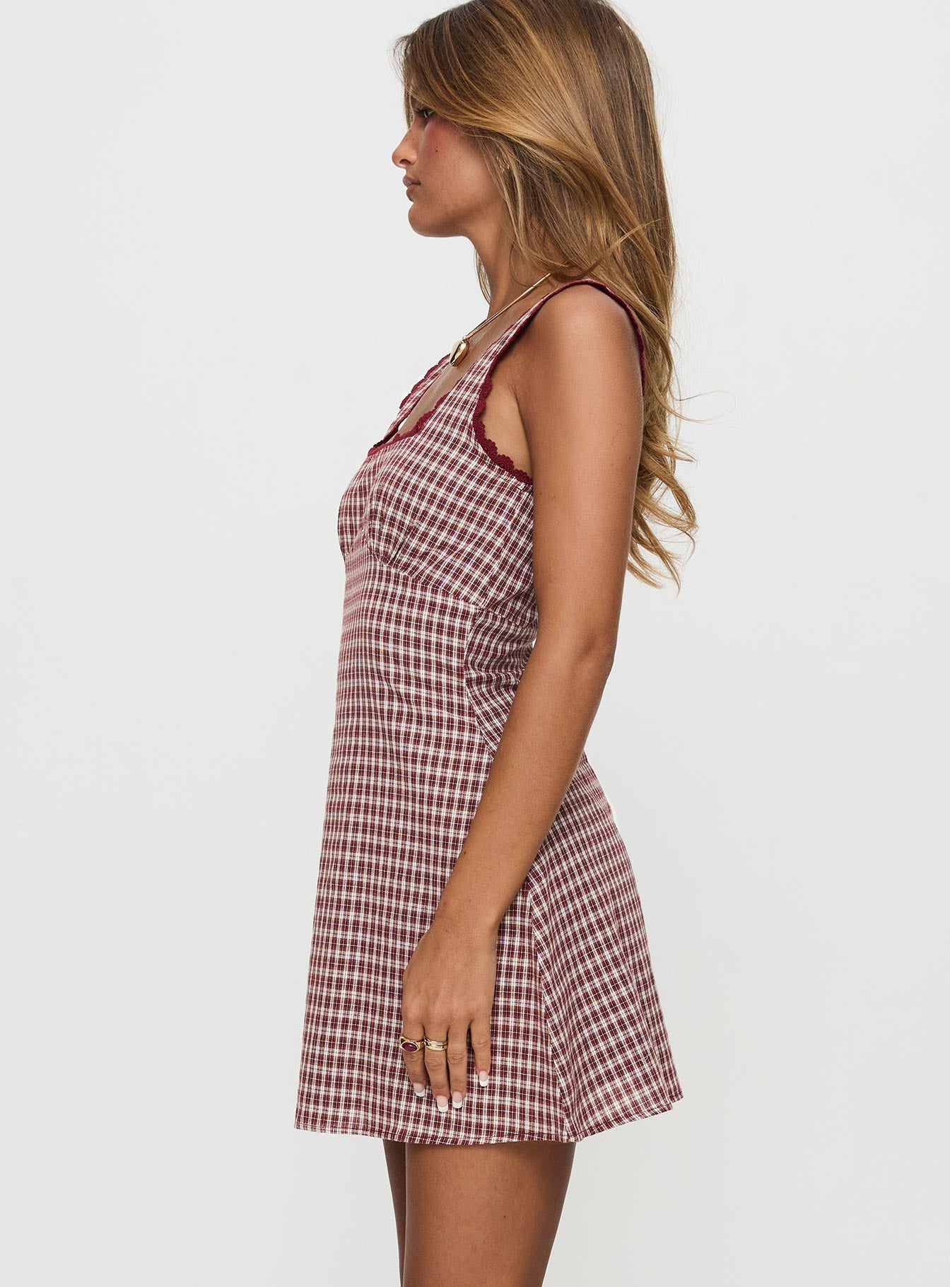 side view of model wearing Princess Polly Dasha Mini Dress Red Check Square Neck 