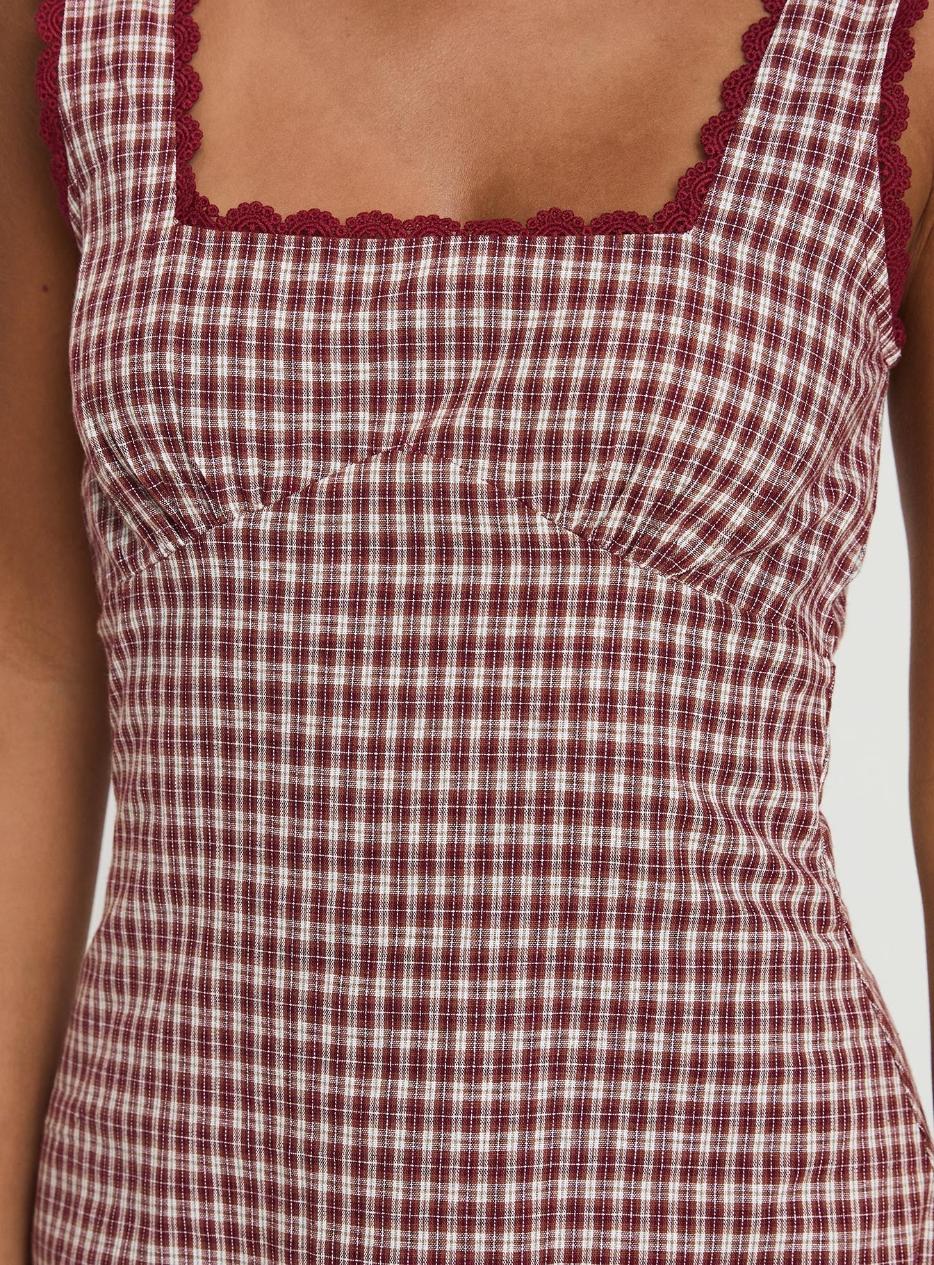 back view of model wearing Princess Polly Dasha Mini Dress Red Check Square Neck 